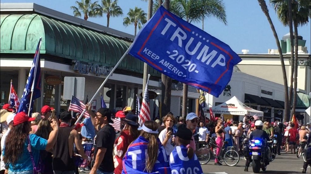 Trump supporter waving flag Photo credit: Joe Trujillo