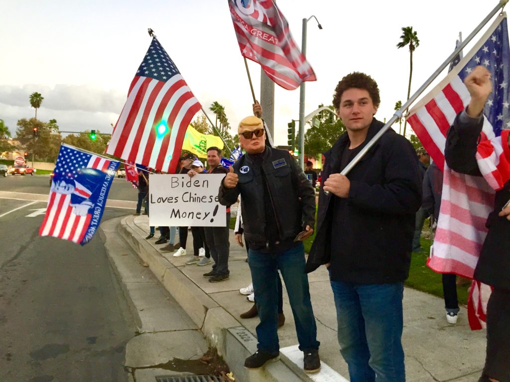 A line of Trump supporters protesting the presidential election results along Imperial Highway. Photo credit: Joe Trujillo
