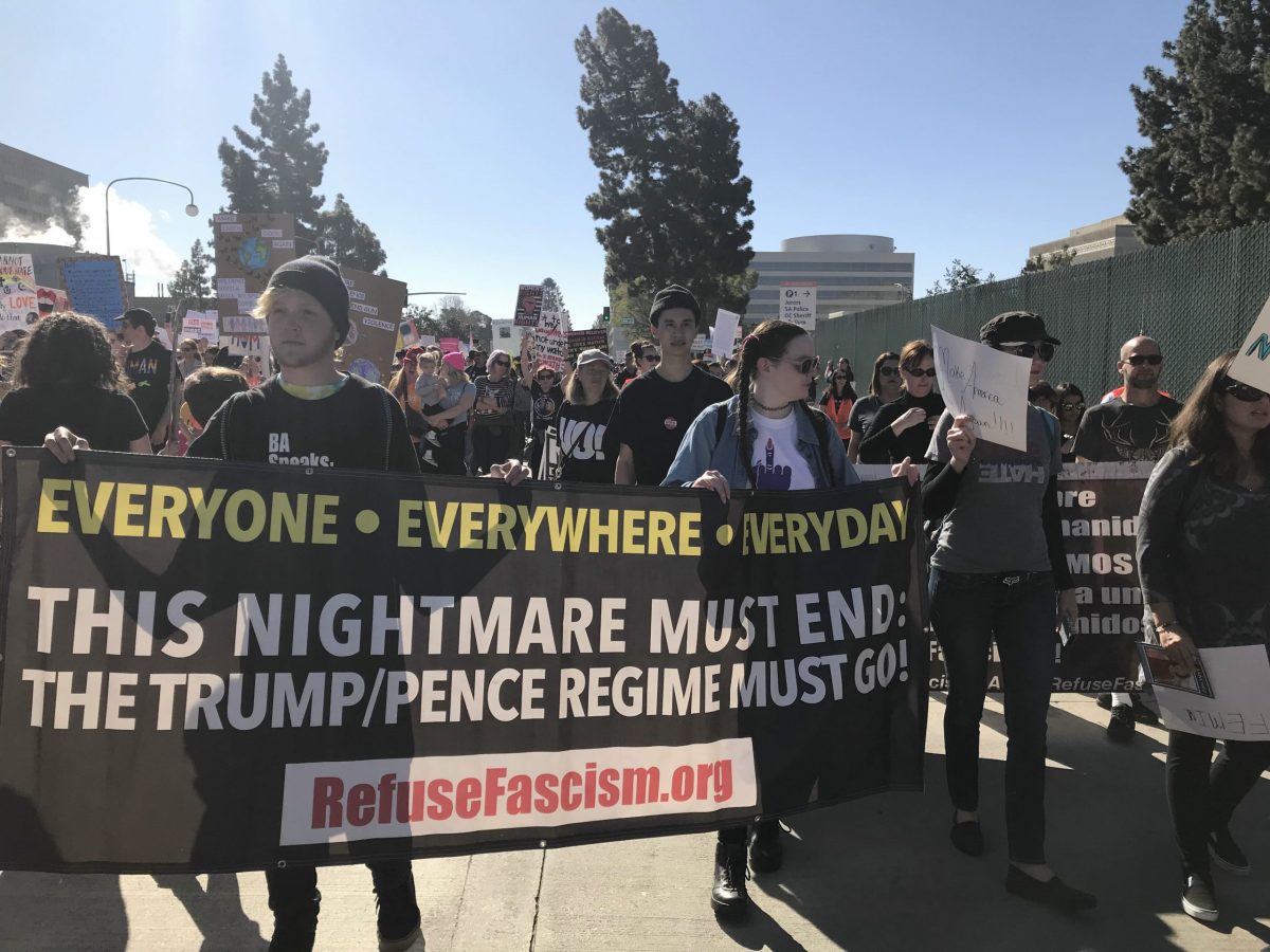 Caption: Anti-Trump demonstrators mobilize at the 2019 Women's March in Santa Ana. 

Credit: Christian Rangel