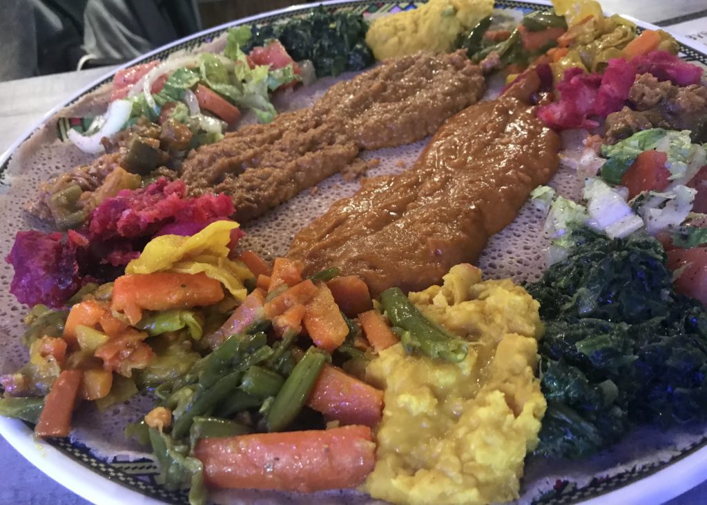 This is the Vegetarian Special, which is a meal of lentils, black lentils, sweet lentils, siro, cabbage, attar keke, okra and salad. Photo credit: Hannah Shields