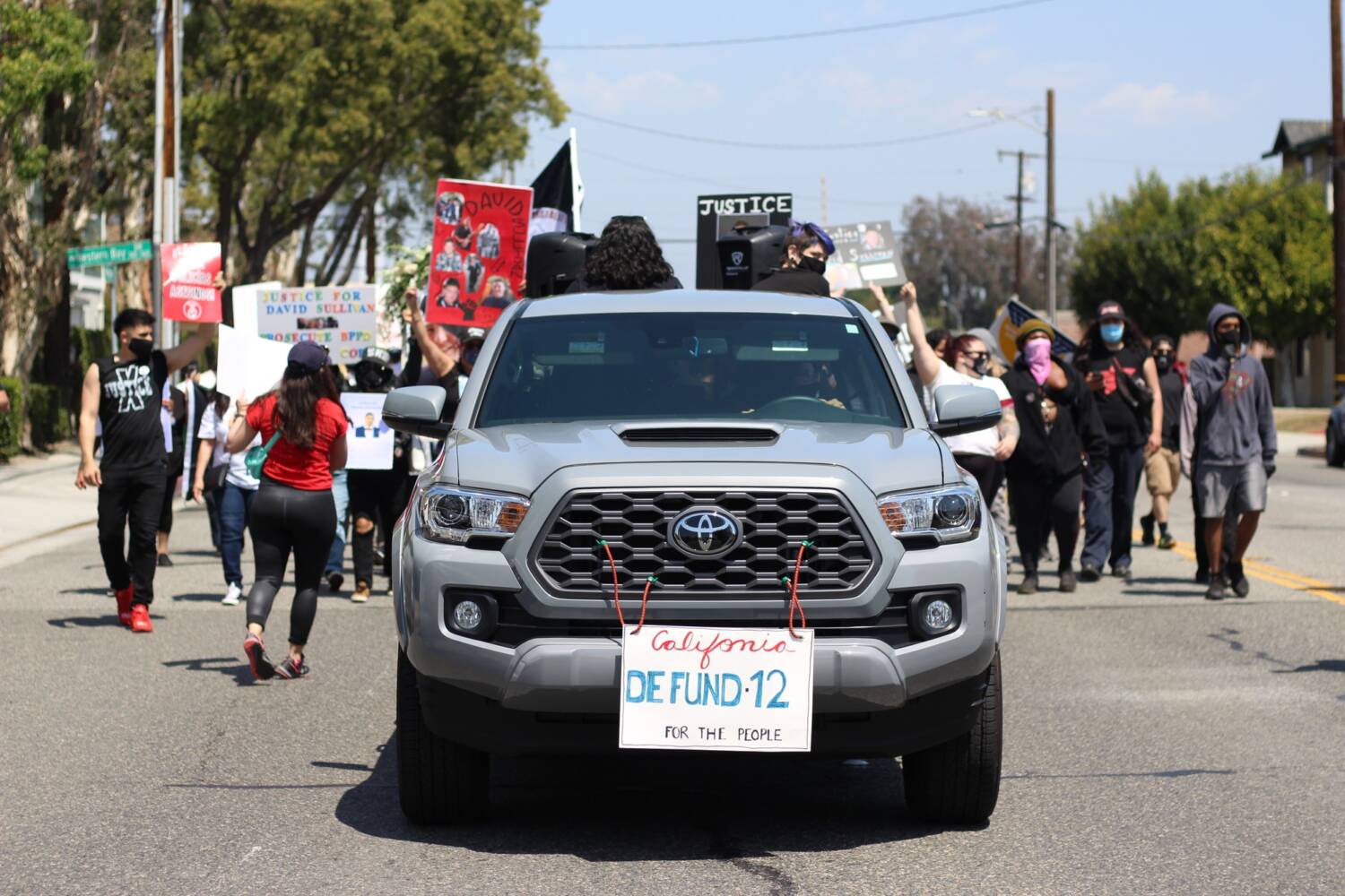 About 50 people protested in the march, walking and driving through neighborhoods and city streets bringing attention to the issue as Buena Park residents watched from their properties. Photo credit: Myron Caringal