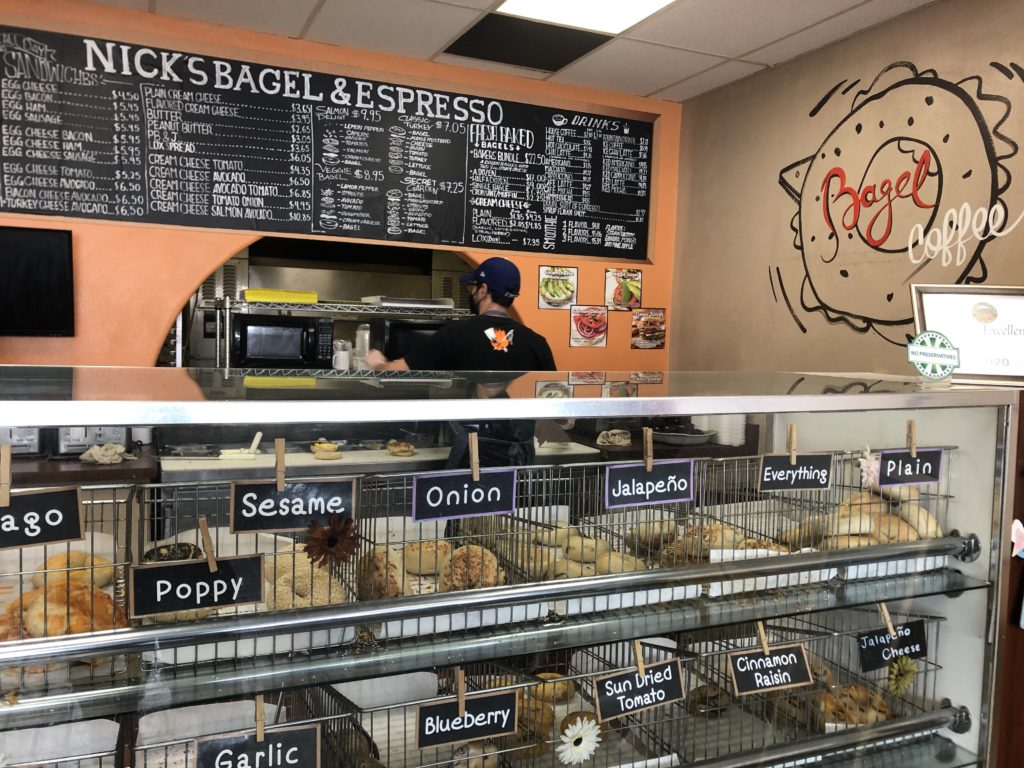 Bagels are on display at Nicks Bagels and Espresso while the hand-drawn menu shows the restaurants large variety. Photo credit: Blare Parke