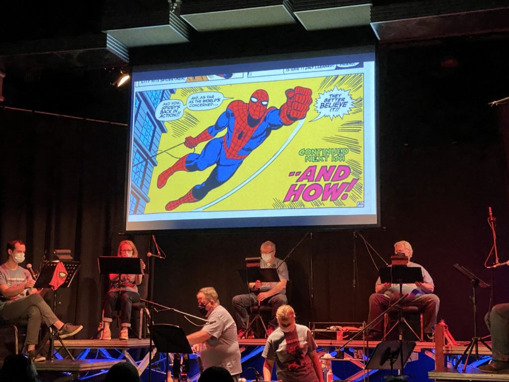 Actors gather on stage to perform a live comic book reading of The Amazing Spider Man at the Maverick Theater. Photo credit: Rachel Lopez