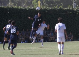 Fullertons Pablo Lozano leaps to head a ball. Lozano scored the only goal of the game. Photo credit: Jared Chavez