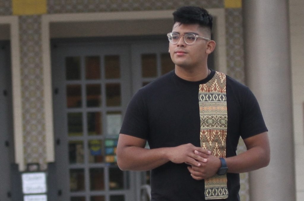 Fullerton College student Alejandro Aguilar stands by in front of the campus library. This being his third year at the college, Aguilar looks to transfer in fall 2022. Photo credit: Ethan Ahoia