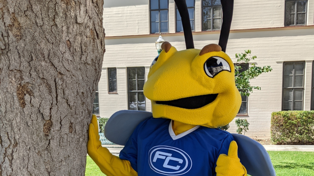 The newly redesigned 2022 Fullerton College mascot Buzzy the Hornet is shown posing on campus. Photo credit: Lisa McPheron
