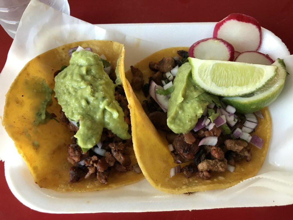 Two Al pastor tacos with everything on them from Palapas Tacos. Photo credit: Dylan Faircloth