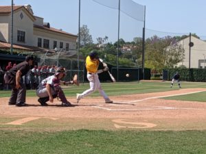 Jacob Sharp (#19) from Fullerton College connects on a swing to make a run for first at Fridays home game. The final score was 12-3 Saddleback College. Photo credit: Valerie Strummer