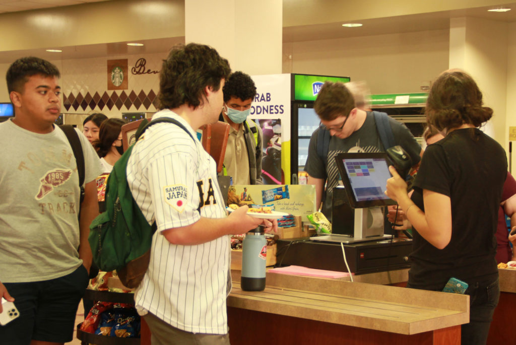 A student waits to pay for his food in the Fullerton College cafeteria using his free meal credit. Getting a student ID is needed in order to receive this credit. Photo credit: Matthew Gonzalez