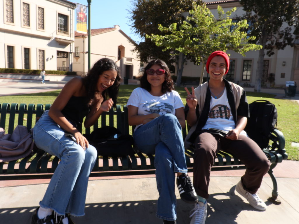 Freshman Dani Pardo, sophomore Catherine Cruz, and sophomore Rain Galaz hang out at Fullerton College, enjoying the in-person interaction this semester. Photo credit: Jake Rhodes