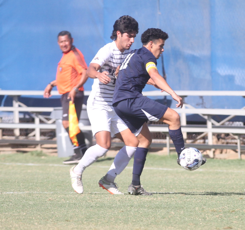 Fullerton sophomore forward Diego Anaya defends the ball from Cypress sophomore forward Daniel Klebau during their first home conference game of the season on Tuesday, Sept. 27. Photo credit: Matthew Gonzalez