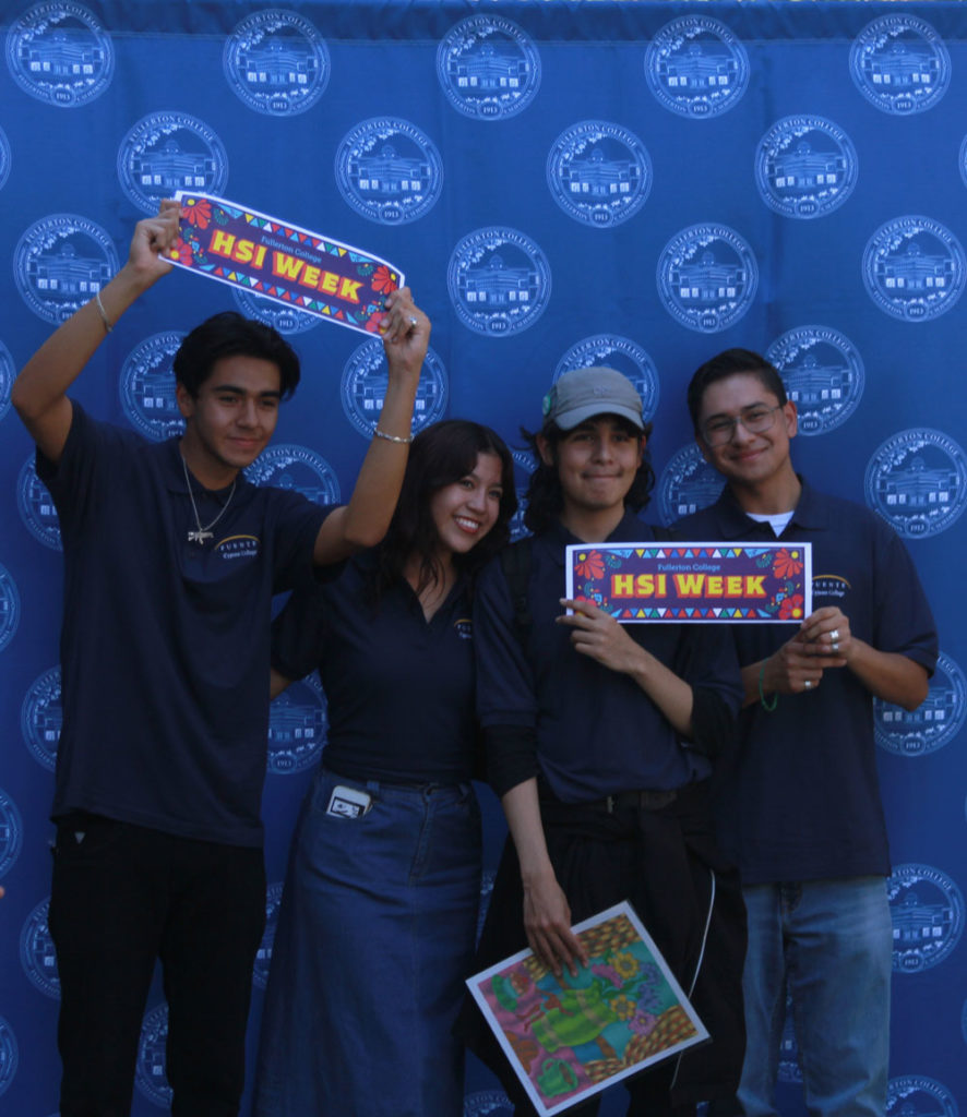 Cypress College students from the Puente Program pose with signs as they visit Fullerton College on Sept. 15, 2022 to celebrate HSI week and Hispanic Heritage Month. Photo credit: Sara Leon