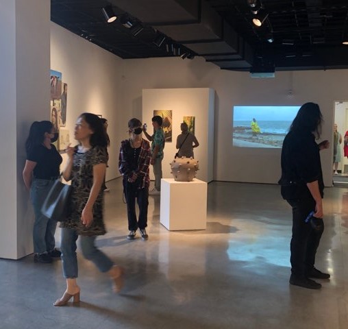 Attendees at the Faculty Art Exhibition on Thursday, Sept. 8 at the Fullerton College Gallery. Photo credit: Gerardo Chagolla
