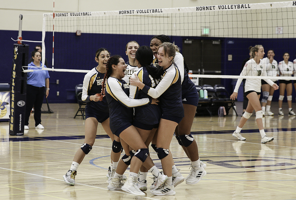 During the Fullerton College home game on Wednesday, the Hornets celebrate freshman Haley De La Riva securing a point after making a hard kill against Golden West in the 3rd set. Photo credit: Aaliyah Skipper