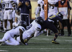 DB Maximus Ahoia catches WR Calvin Littles causing him to fall short yards of the endonze.