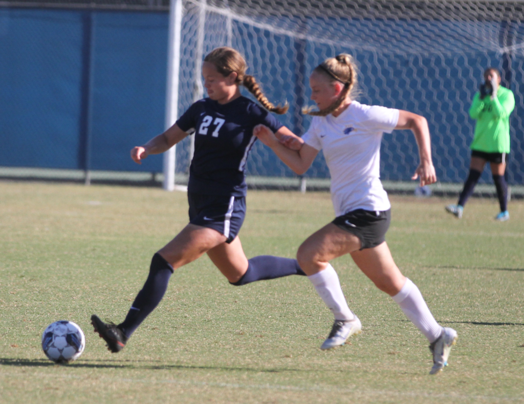 Fullerton sophomore midfielder Auburn Burnette defends the ball from Santiago Canyon in their second conference game off the season at home on Friday, Sept. 30 Photo credit: Abel Mendiola