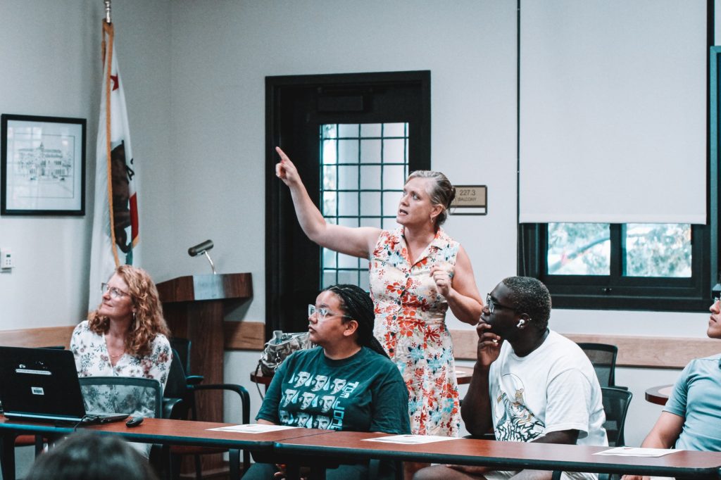 Fullerton College business instructor Kathy Standen and students listen as Angela Henderson, Study Abroad Program coordinator, leads an on-campus Seville information session on Sep. 7, 2022. Photo credit: Aaliyah Skipper