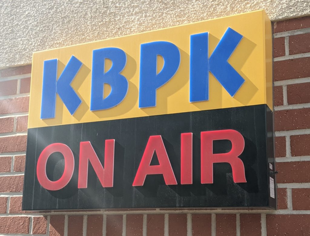 The iconic KBPK signage outside the 1300 building. KBPK has been broadcasting for 50 years. Photo credit: Cyrus Burton