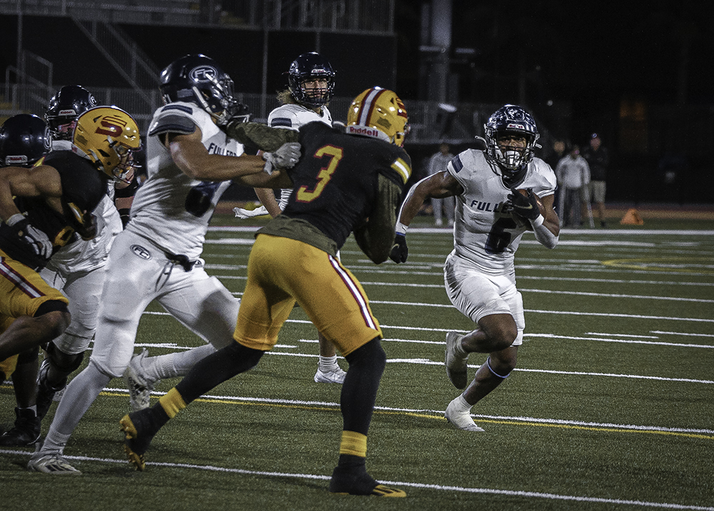 At 2nd and goal, sophomore running back Malik Winston with the carry, runs through Saddleback territory finishing with a touchdown for Fullerton during the away game Saturday, Nov 5. Photo credit: Aaliyah Skipper