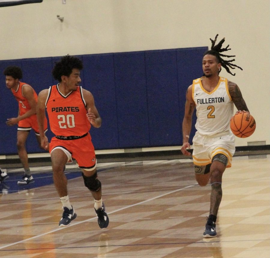Sophomore forward Javon Jones attacks the full court pressure being put on by freshman guard Nikko McNeal amd the rest of the Pirates Friday, Feb. 3.