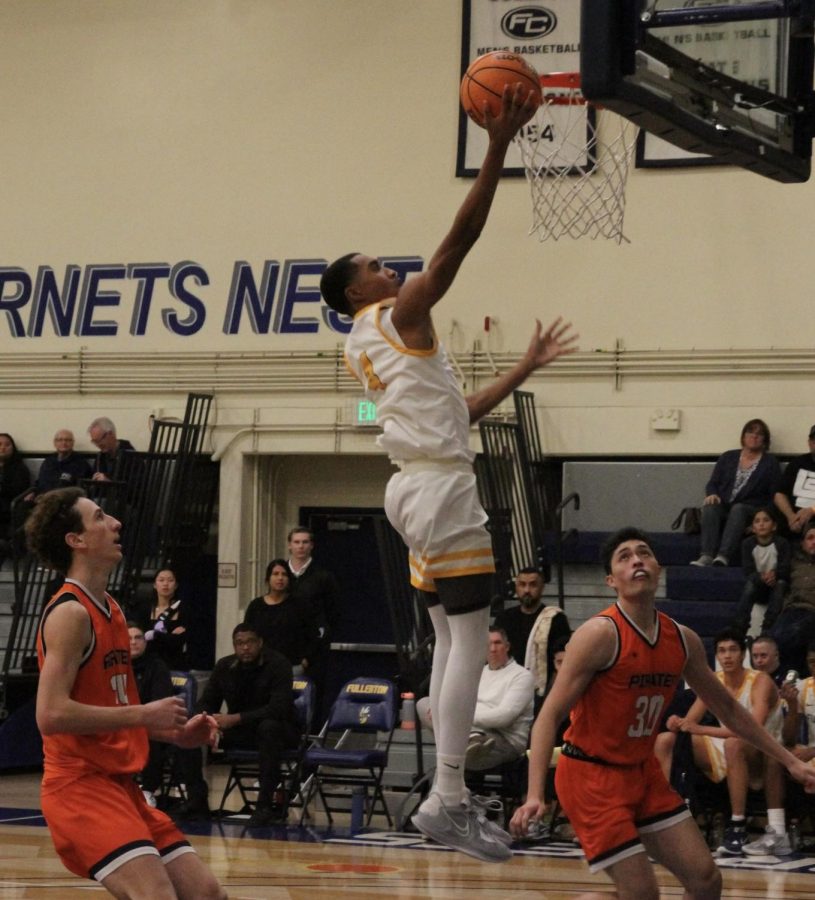 Freshman guard Sean Newman Jr. coverts an easy layup inside the Hornets Nest Friday, Feb. 3.