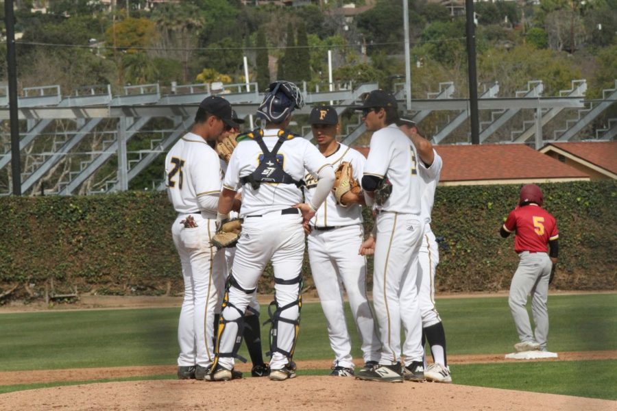 Fullerton infield has a quick talk on the mound on Feb. 17, 2023 at Fullerton College. Photo credit: Yasmin Sotelo