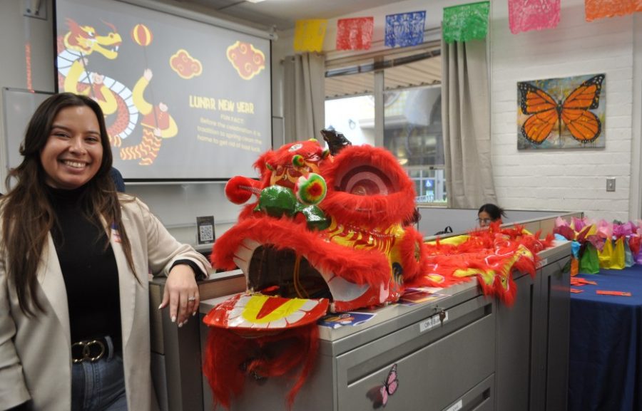 Dr. Connie Moreno Yamashiro, Director of the Grads 2 B poses with Chinese Lion costume at Open House Thurs., Jan. 26, 2023