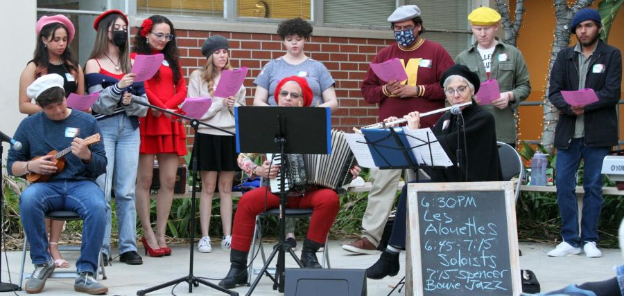 French Film Festival Cultural event, Monday, March 27, 2023 at campus theater patio, Fullerton College. Les Alouettes start off the musical portion. Christine Garner, in red beret, plays the accordion.