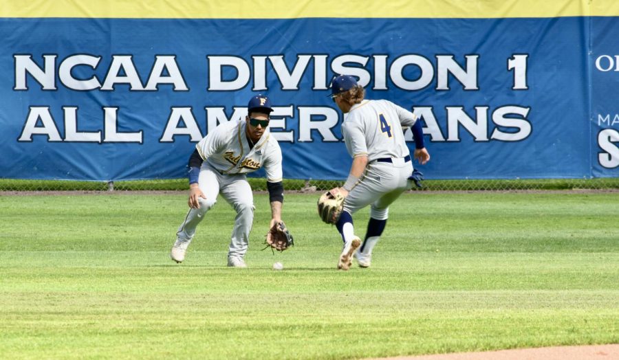 Freshman center fielder Isaiah Marquez and sophomore right fielder Jared Benash hurry to field a ball that dropped in the open space during Thursday's away game on March 23, 2023.