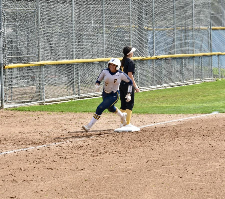 Third baseman sophomore Alendy Aguilar runs for home on a double hit to center field during Friday's home game on March 17, 2023.