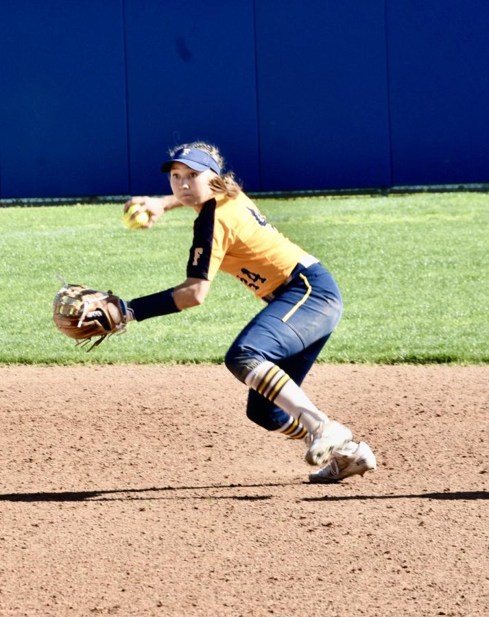 Freshman utility player Cassidy Hornung throws a fielded ball to first base to get the last out and secure the victory during Friday, March 24, 2023, home game.