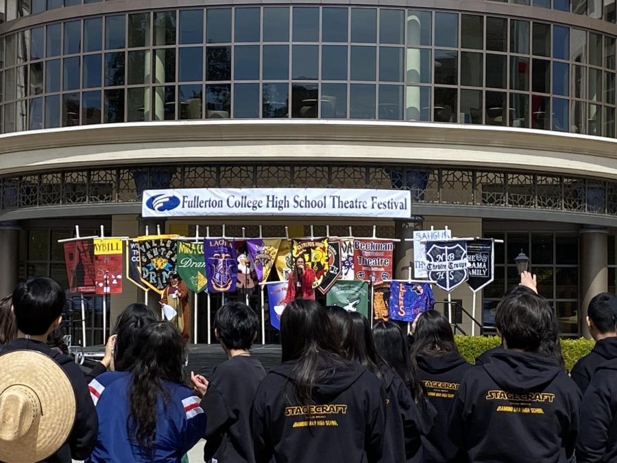 High School students glance at the different school banners on the initiation speech of the Fullerton College High School theater festival on Mar.17, 2023