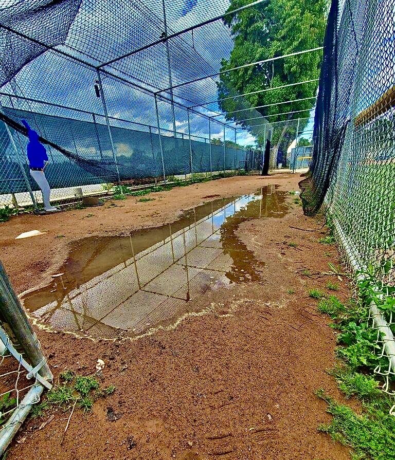 On rainy days, the bullpen at Fullerton College's women's softball field collects puddles of water, making it impossible to practice and creating unsafe conditions for its players.