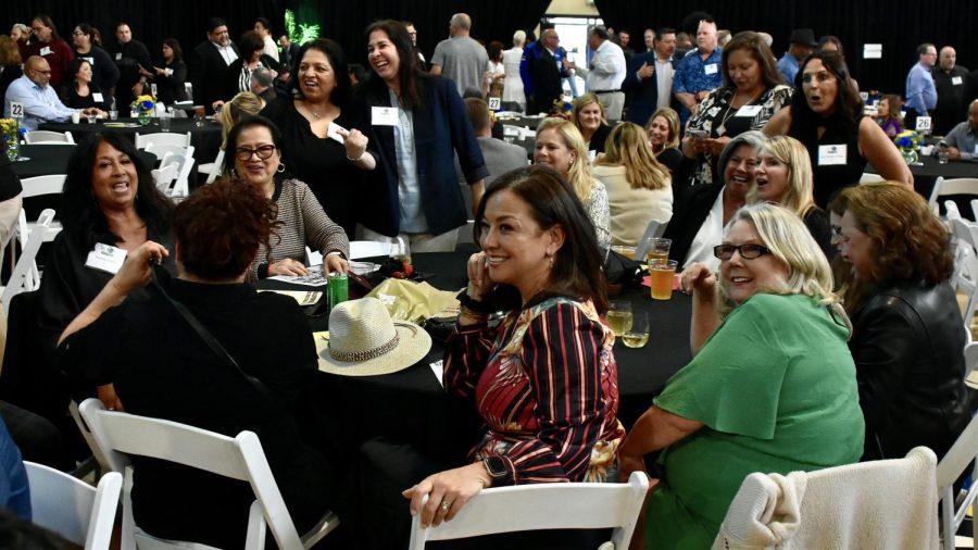Former Hornets get situated at their table to enjoy the evening where their accomplishments at Fullerton College will be cemented forever in history on Friday, April 14, 2023.