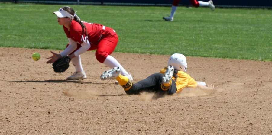 Freshmen Haley Perez dives in to steal second base against Santa Ana at Fullerton College on April 1, 2023.
