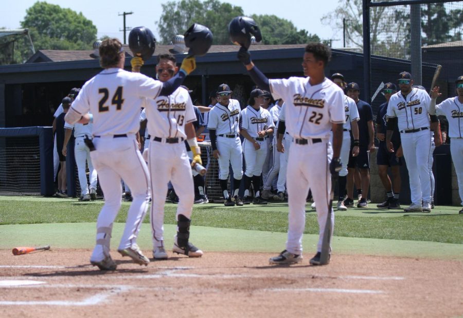 Freshmen center fielder Britton Beeson celebrates with sophomore catcher Haku Dudoit (left) and sophomore right fielder Isaiah Marquez (right) after smashing a home run against Golden West at Fullerton College on Saturday April 15, 2023. Photo credit: Yasmin Sotelo