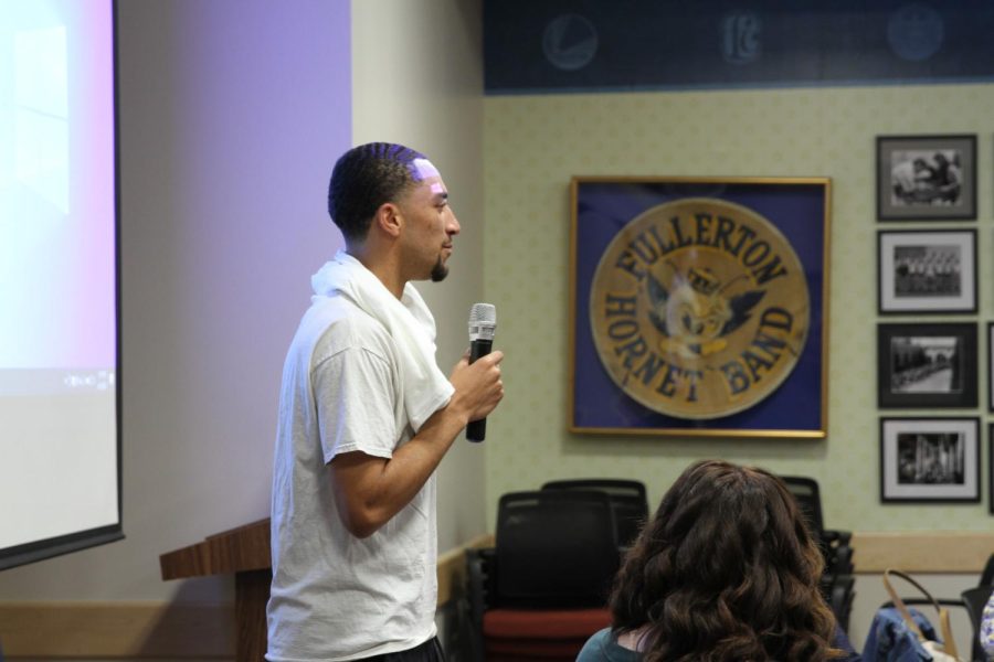 Sophomore guard and team captain Kobe Newton says a few words in the faculty senate meeting room during the mens basketball celebration on April 6, 2023. Photo credit: Yasmin Sotelo