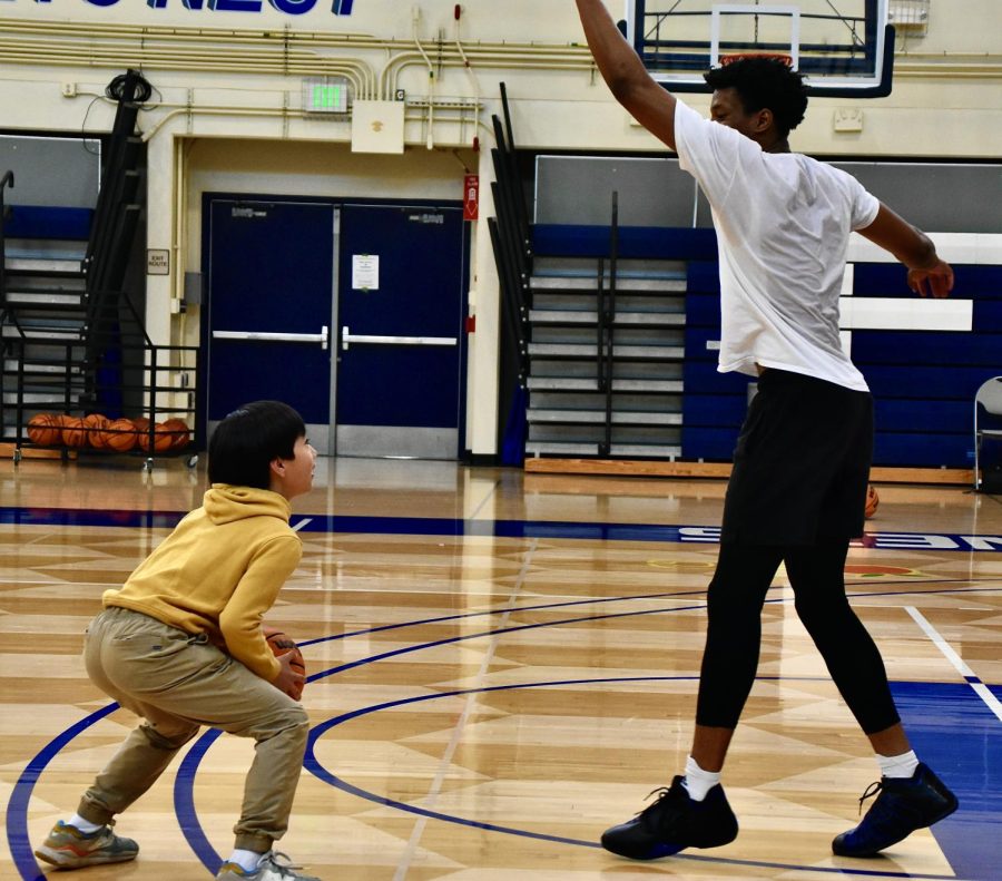 In addition to playing basketball, 12 year old History Major Clovis Hong practices archery to stay physically active.