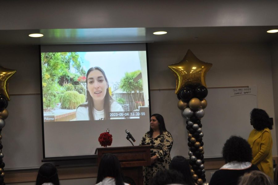 Stephanie Rodriguez introduces a video of Paloma Foster, made in advance to play at the event, explaining that Paloma only thought she was doing a thank you speech for Student of Distinction and had no idea it would be played for her being awarded one of the two Distinguished Student of the Year. Student Life and Leadership coordinator Les Sie Crockrum, in yellow at far right, one of the judges of the event. at Fullerton College on Friday, May 5, 2023 in the 200 Student Center room 224,226,228.