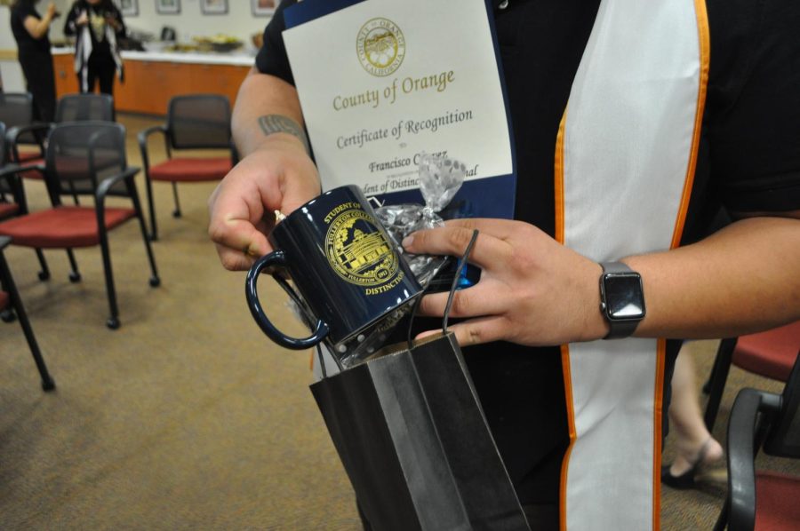 Francisco Chavez with gift bag for the Students of Distinction, Friday, May 5, 2023 at Fullerton College