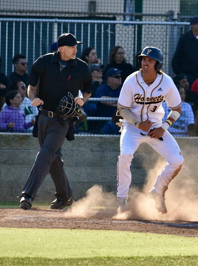 Freshman first baseman Tank Espalin shows all the emotion as the dust settles from his slide, giving the Hornets a much needed insurance run in the eighth inning at home Thursday, May 11, 2023. Photo credit: Gerardo Chagolla