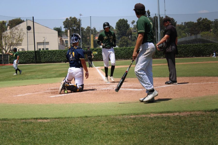 Sophomore UTI Tyler Olivas scores a homerun on for the Monarchs against The Hornets on Friday, May 12, 2023.