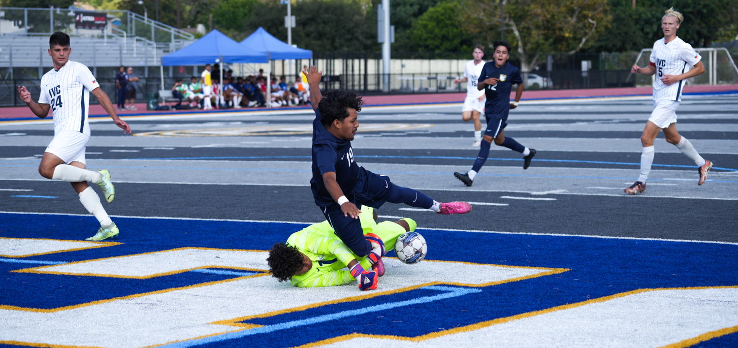Freshman midfielder Omar Ruiz comes up just short of beating Lasers freshman goalie Christopher Azarte to the ball, as Azarte did just enough to knock the pass away at Sherbeck Field on Sept. 29, 2023.
