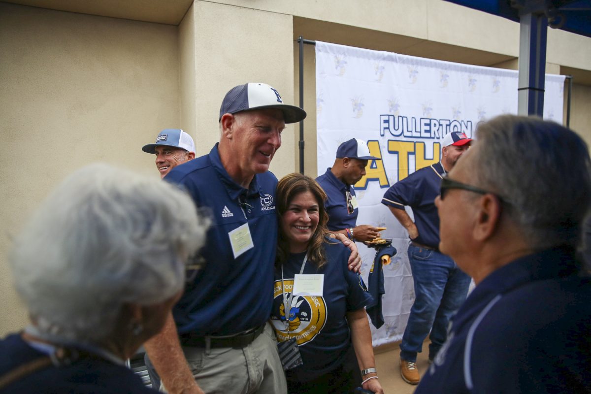 Fullerton College Athletic Director Scott Giles meets with VIP attendees at the new Sherbeck Field on Saturday, Sept. 2, 2023.