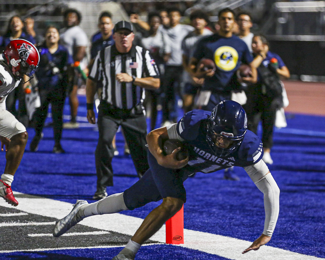 Hornets sophomore quarterback Brandon Nunez dives into the end zone to earn his third rushing touchdown of the night at Fullerton College on Saturday, Sept. 2, 2023. 