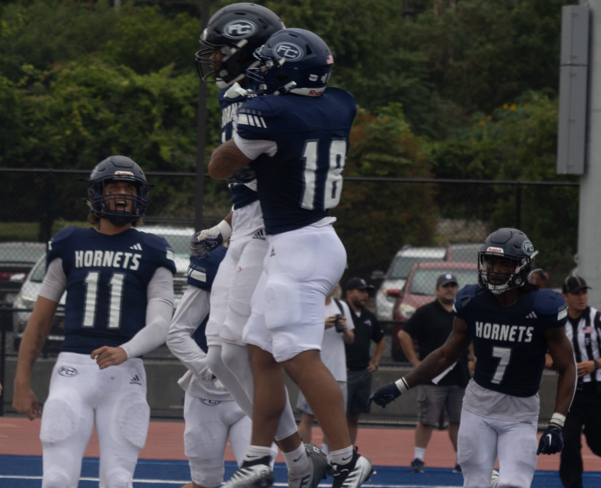 Sophomore quarterback Brandon Nunez celebrates a touchdown with his teammates in the second quarter at Sherbeck Field on Saturday, Sept. 16.