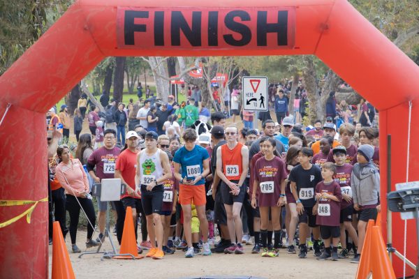 Runners from all over gather at the starting line, eager to showcase their true speed. Some are even sporting their Halloween costumes for the year. Since the trail loops, the quickest runner is the one who returns and crosses the finish line first.