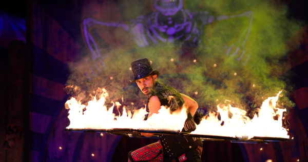 Sorcerer performs with fire during Le Magnifique Carnaval du Grotesque Show at Knotts Scary Farm on Oct. 4, 2023.