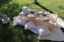 The finished display of the theme Jasmin picked, a dainty and romantic baby pink picnic that awaits her and her friends.