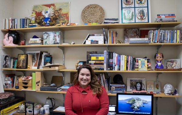Professor Megan Lorraine Debin has an eclectic collection of books and cultural items in her office. 